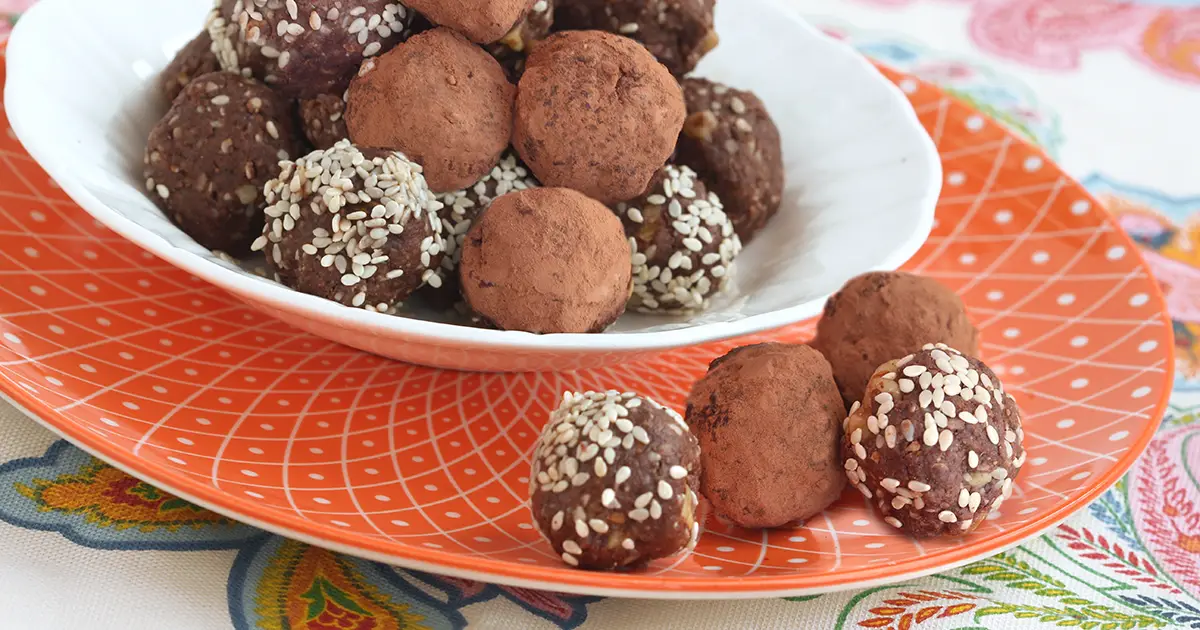 Plate of no bake chocolate protein bites.